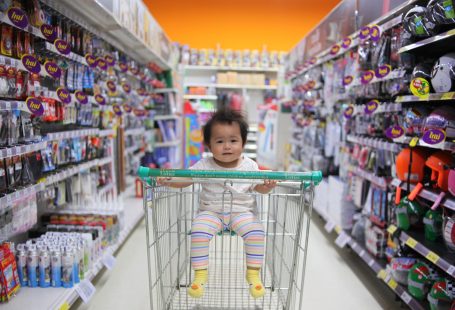 Baby on white shopping cart