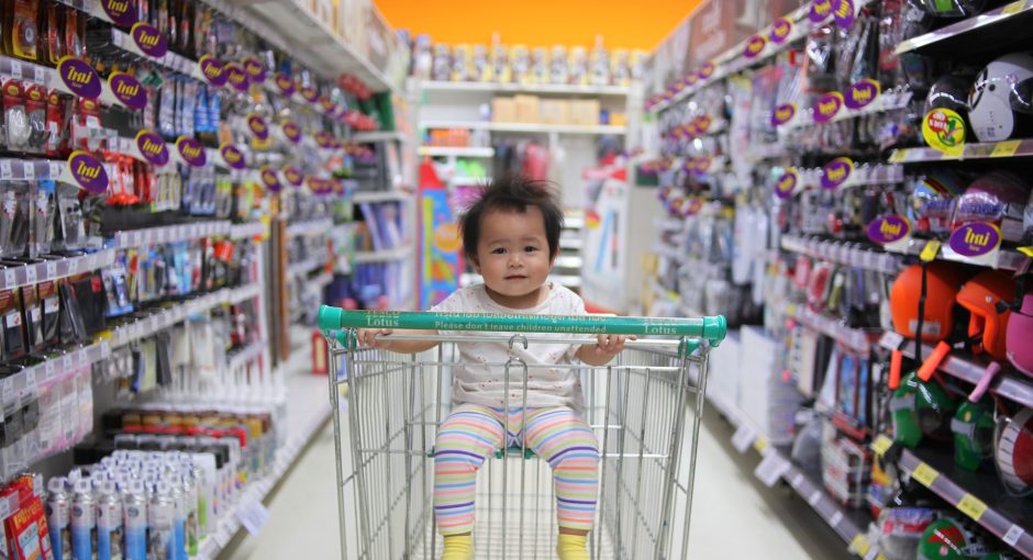 Baby on white shopping cart