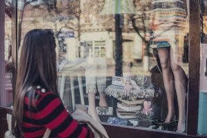 Woman looking at shop window